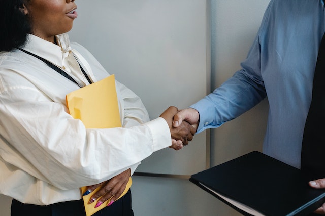 shaking hands in business clothes