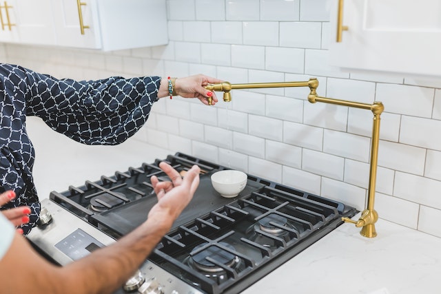 two people looking at kitchen sink