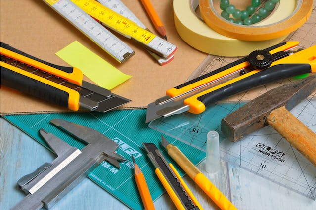 A collection of tools on a table.