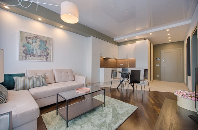 A large, neutral-toned living room