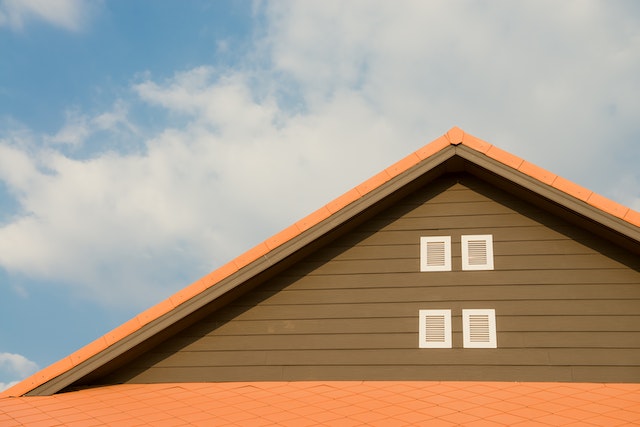 The exterior of the top half of a house.